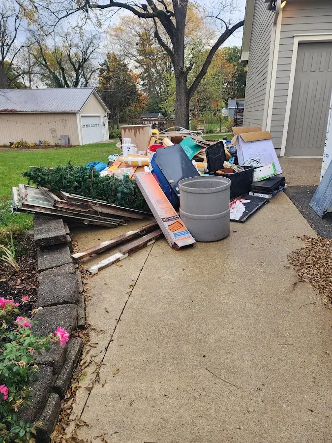 Dumpster being loaded with debris for Roofing Dumpster Rental in East Gaffney